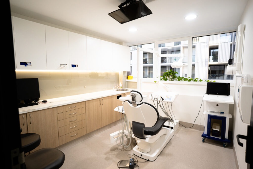 Dental treatment room with a dental chair and equipment